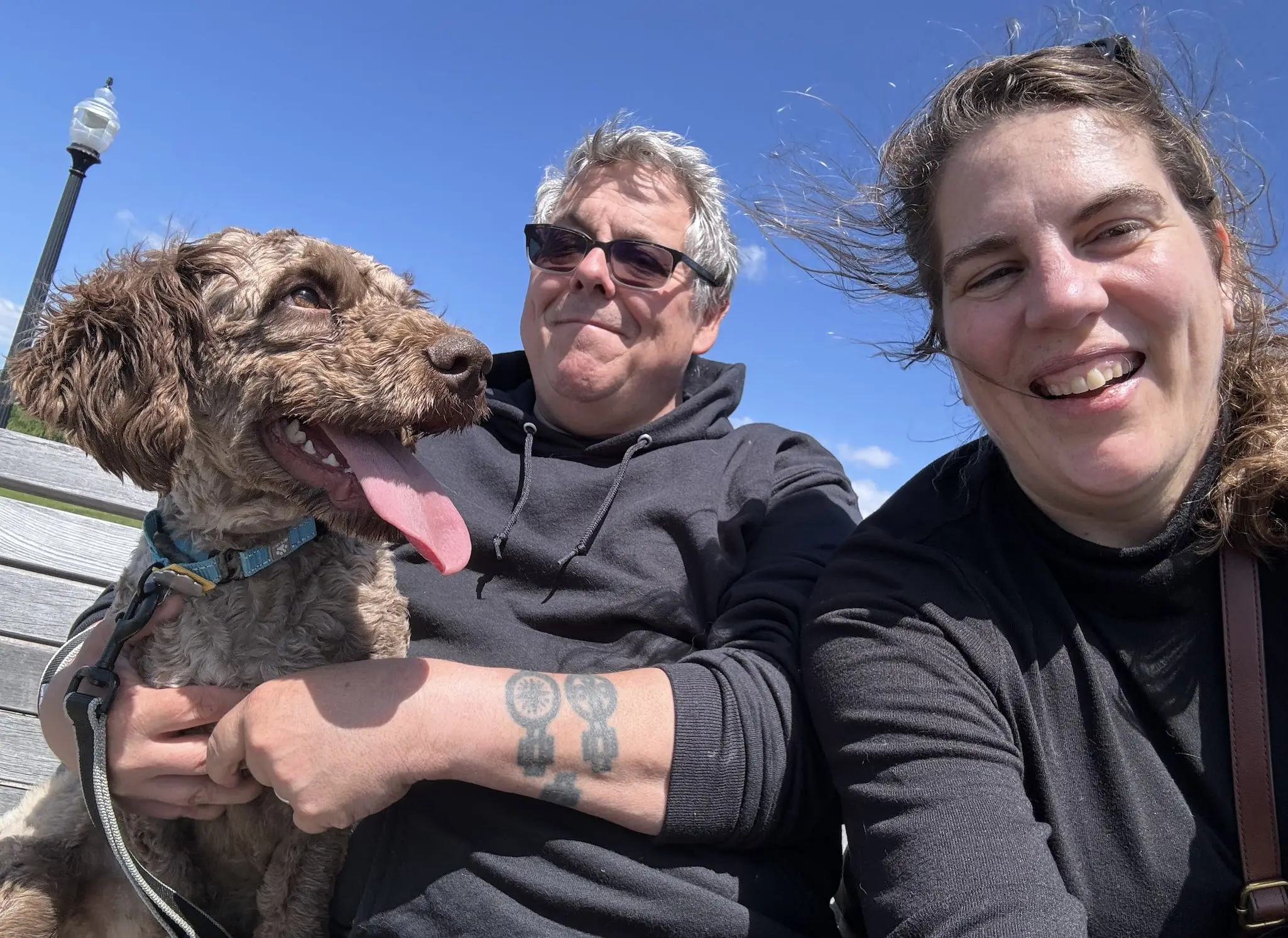 Keith Kinsella professional dog walker with wife Daniela and their dog Rasmus enjoying outdoor time in Jersey City, New Jersey