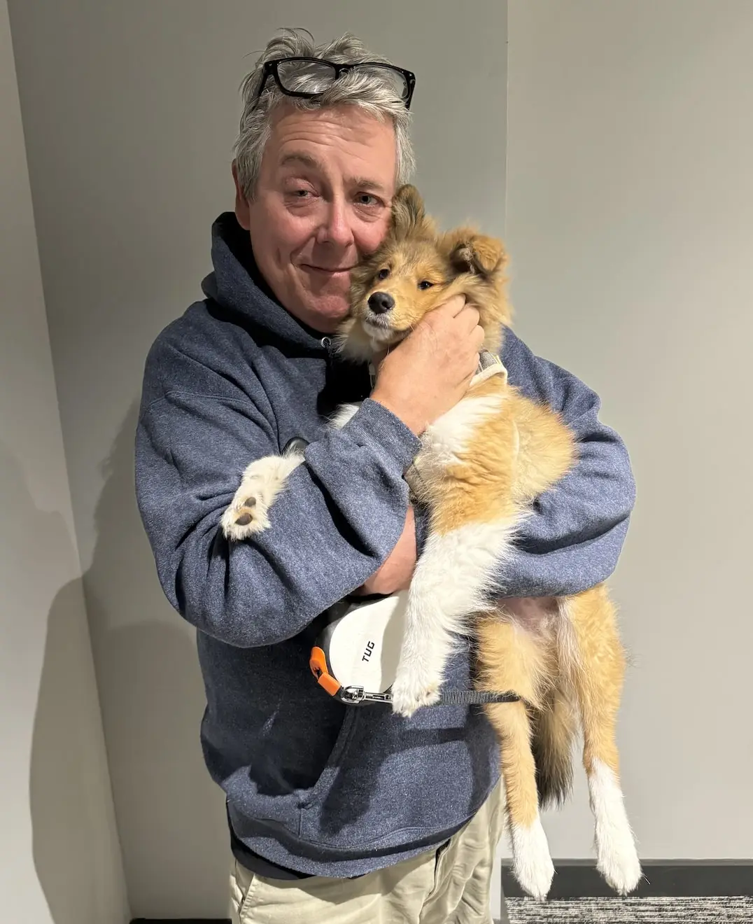 Keith Kinsella holding puppy with love - professional dog walker and pet sitter in Jersey City